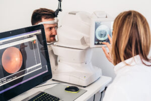 An image of an eye doctor analyzing a retinal image